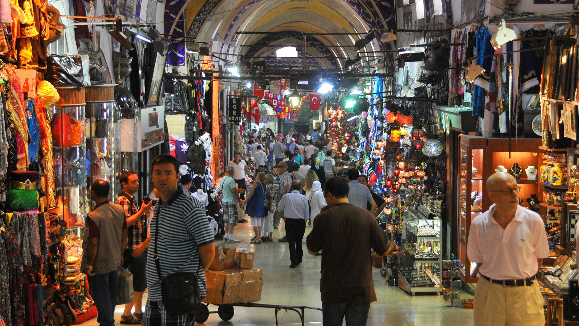Interior of the Grand Bazaar with shops and hanging lights